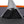 Black mesh storage pocket on grey grid patterned tent fabric with a water bottle inside