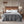 Woolrich grey heated blanket on a bed with wooden headboard