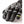 Black and white patterned winter glove with leather fingertips and grey reflective stripes
