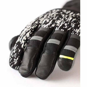 Black and white patterned winter glove with leather fingertips and grey reflective stripes