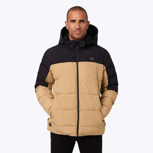 Man wearing a two-tone tan and black Mobile Warming hooded puffer jacket