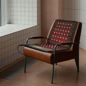HealthyLine infrared therapy mat on a brown armchair