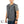 Mobile Cooling quilted grey vest on a model wearing a grey t-shirt and jeans
