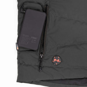 Mobile Warming battery pack connected inside a zippered pocket of a grey jacket
