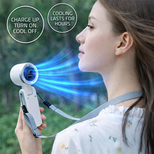AlphaCool handheld fan with digital display blowing air on a person