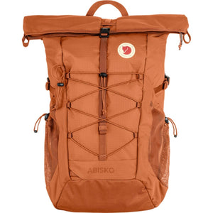 Fjallraven Abisko 25 rolltop backpack in terracotta orange with front bungee cord system and side mesh pockets
