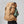 Person wearing a tan FjallRaven Kajka 55 trekking backpack