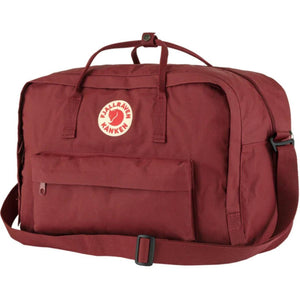 FjallRaven Kanken burgundy duffel bag with top handles and shoulder strap