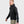 Man wearing a black FjallRaven hooded fleece jacket with a chest pocket