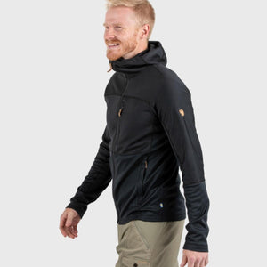 Man wearing a black FjallRaven hooded fleece jacket with a chest pocket