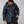 Man wearing a navy blue Fjallraven hooded puffer jacket