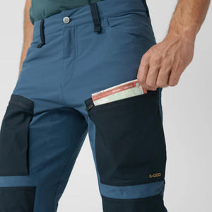 Fjallraven Abisko trekking trousers with a map in the zippered leg pocket