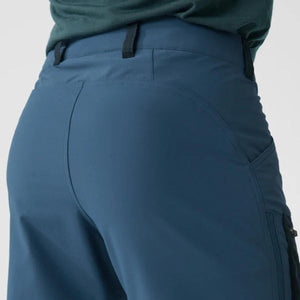Close up rear view of blue hiking pants with belt loops and curved seam detailing