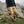 Person wearing FjallRaven beige cargo trousers hiking on a rocky mountain trail