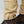 Close up of FjallRaven trouser hem with adjustable button strap and brown hiking boots