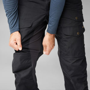 FjallRaven black trekking trousers with side pockets and stretch panels