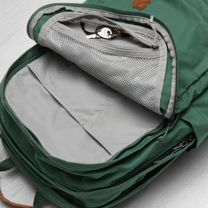 Open FjallRaven backpack showing internal mesh zip pocket and slip compartments