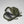 Open FjallRaven green backpack showing internal laptop sleeve and packed items
