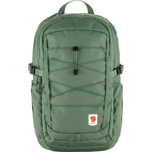 Fjallraven green backpack with front bungee cord system and logo patch