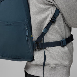 Side view of FjallRaven backpack showing adjustable waist strap and zipper pocket