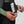 Hands adjusting the internal drawcord of a Fjallraven jacket