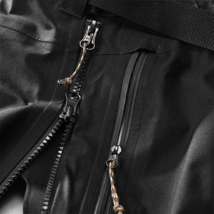 Close up of black waterproof zippers with pull cords on technical outerwear