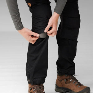 Person inserting knee pad into FjallRaven trekking trousers