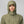 Person wearing an olive green FjallRaven hooded jacket