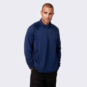 Man wearing a navy blue Mobile Warming quarter zip pullover with textured fabric
