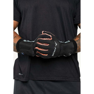 Person wearing black FNDN heated gloves with orange accents