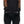 Person wearing black FNDN heated mittens with adjustable wrist straps