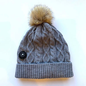 Grey cable knit beanie with a faux fur pom pom and a circular Detroit Foundation Gear logo patch