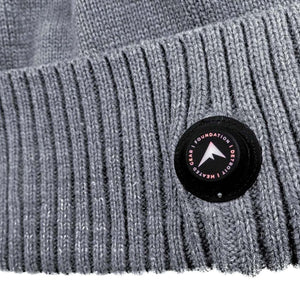Grey ribbed knit fabric with a circular FNDN brand logo patch