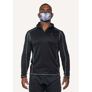 Man wearing a FNDN black quarter zip long sleeve shirt and a patterned face mask