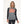 Woman wearing a grey and black long sleeve heated base layer top with visible heating elements