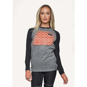 Woman wearing a grey and black long sleeve heated base layer top with visible heating elements