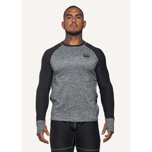 Man wearing FNDN grey and black long sleeve compression shirt with thumb holes