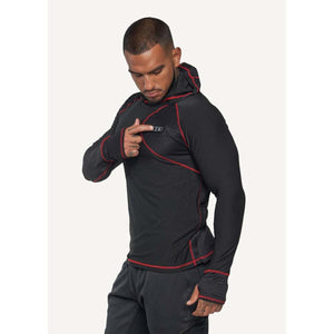 Man wearing a black long sleeve hoodie with red stitching and thumb holes