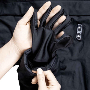 FNDN black glove liner being inserted into a jacket sleeve