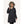 Woman wearing a black FNDN heated parka with a faux fur hood