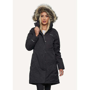 Woman wearing a black FNDN heated parka with a faux fur hood