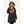 Woman wearing a black FNDN heated parka with a faux fur hood