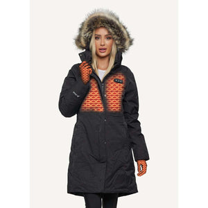 Woman wearing a black FNDN heated parka with a faux fur hood