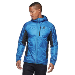 Man wearing a blue Black Diamond hooded jacket with black side panels and a chest pocket