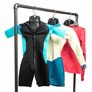 GearDryer drying rack with wetsuits and a jacket hanging on plastic hangers