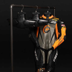 GearDryer drying system hanging inside a motorcycle racing suit
