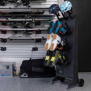 GearDryer portable rack holding ski boots and helmets in a garage