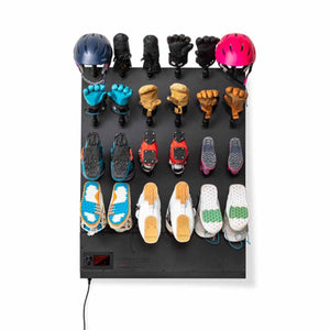 GearDryer wall mounted rack holding helmets gloves and ski boots