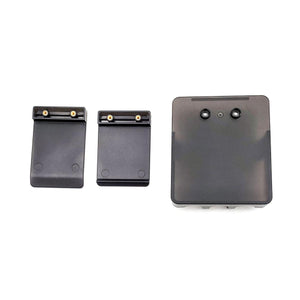 Three black plastic mounting components with metal contact points