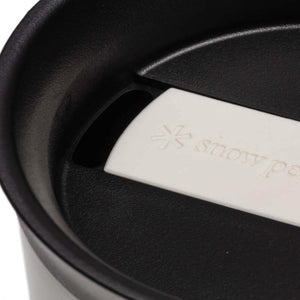 Black Snow Peak tumbler lid with white sliding closure